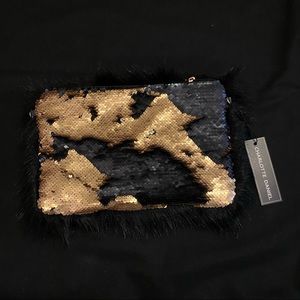 Black and gold sequin wristlett.